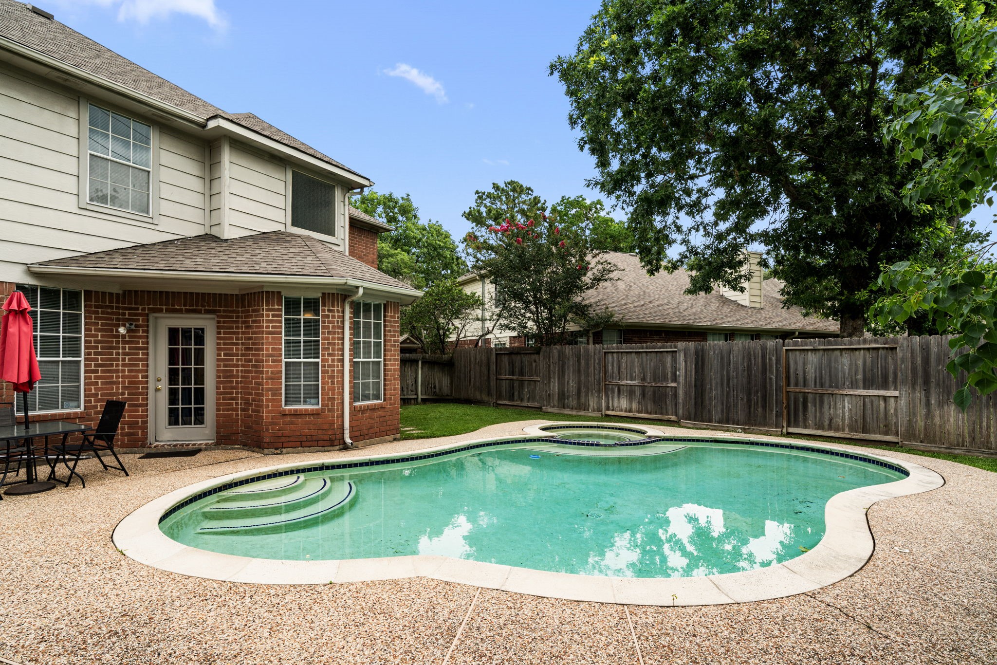 9715 Therrell Drive Houston, TX 77064 - Photo 30 of 33 a swimming pool with barbeque oven in front of it
