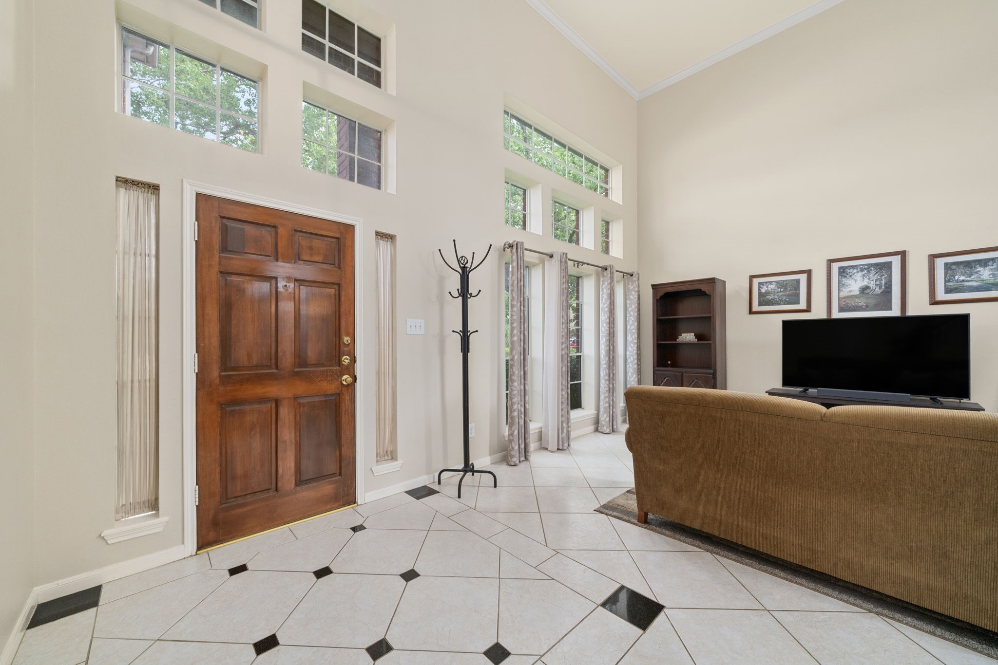 9715 Therrell Drive Houston, TX 77064 - Photo 5 of 33 a living room with furniture and a flat screen tv