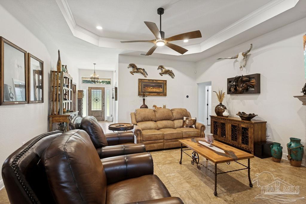 3480 Red Ryder Lane Pace, FL 32571 - Photo 11 of 47 a living room with furniture a ceiling fan and a rug