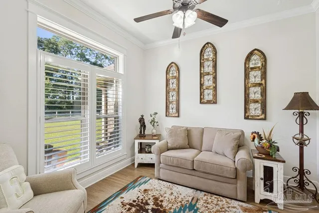 a living room with furniture and a large window