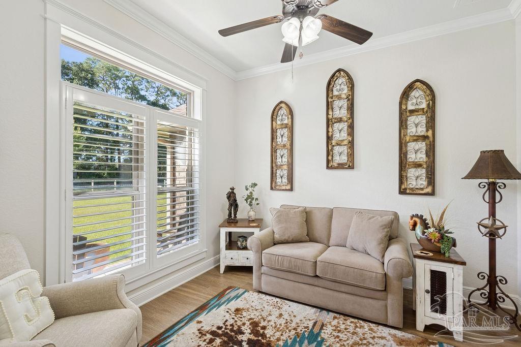 3480 Red Ryder Lane Pace, FL 32571 - Photo 14 of 47 a living room with furniture and a large window