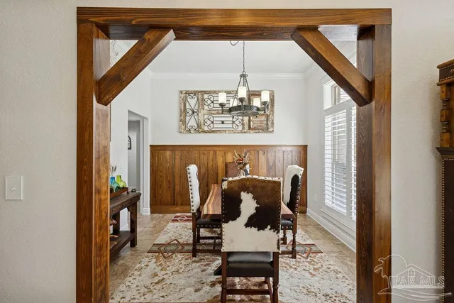 a view of a hallway with seating area and furniture