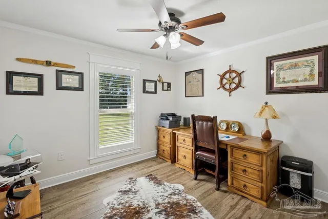 a bedroom with furniture and a window