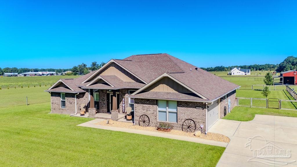 3480 Red Ryder Lane Pace, FL 32571 - Photo 39 of 47 a front view of a house with garden