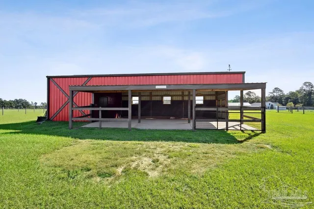 a view of house with a yard