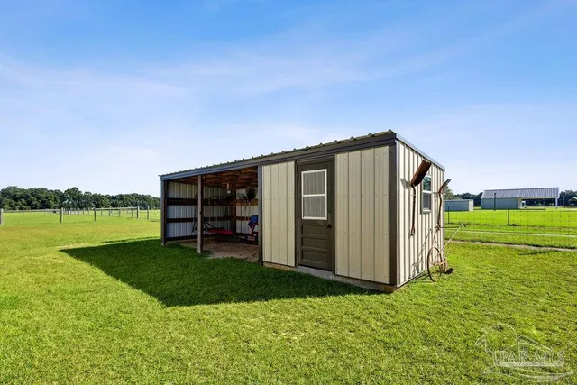a backyard of a house with lots of green space and mountain view in back