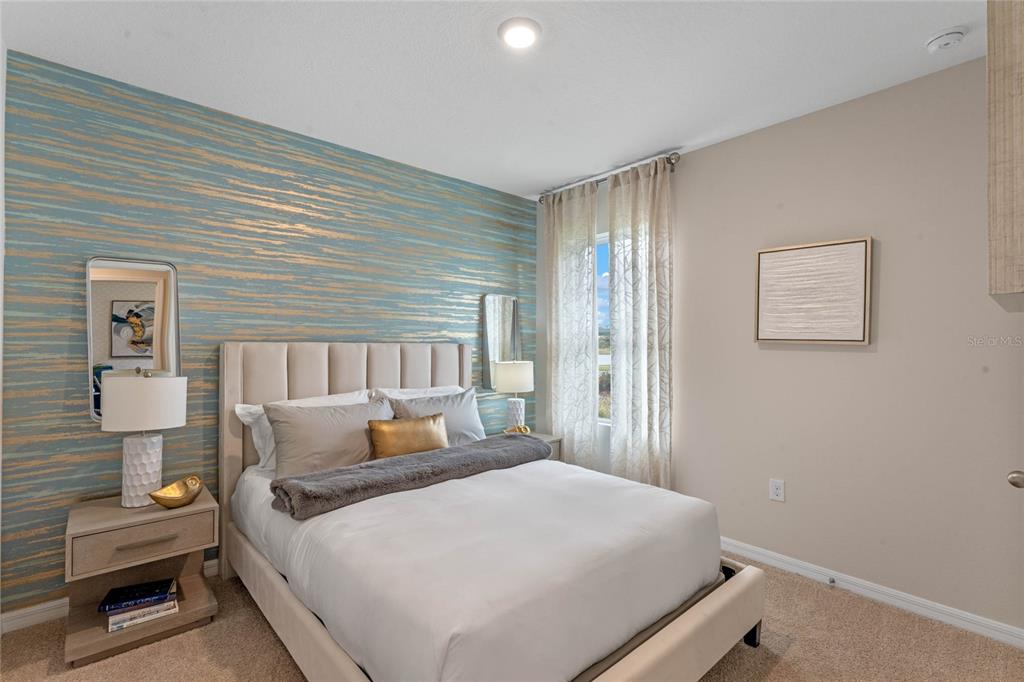 1008 Commons Way Port Port Orange, FL 32129 - Photo 21 of 27 a bedroom with a bed and wooden floor