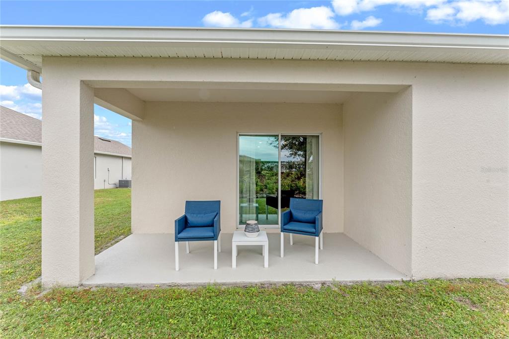 1008 Commons Way Port Port Orange, FL 32129 - Photo 27 of 27 a living room with furniture and a potted plant
