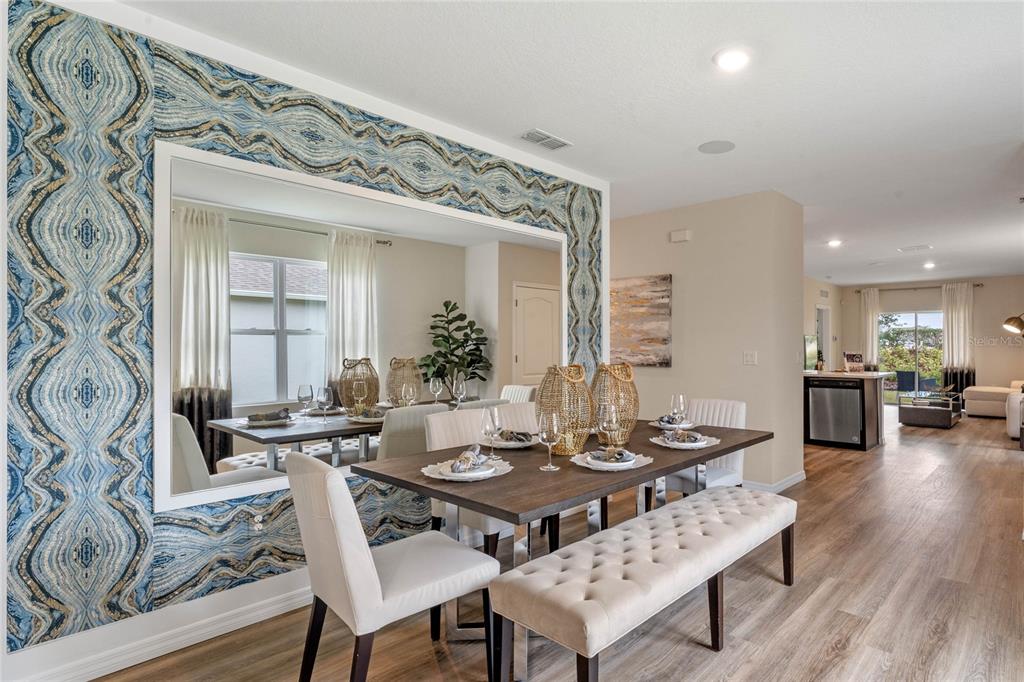 1008 Commons Way Port Port Orange, FL 32129 - Photo 3 of 27 a view of a dining room with furniture