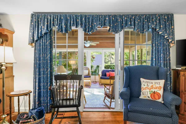 a large kitchen with cabinets wooden floor and stainless steel appliances