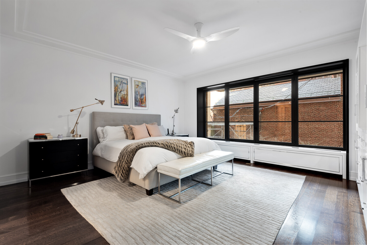155 East 79th Street, Unit MAIS Manhattan, NY 10075 - Photo 5 of 10 a spacious bedroom with a bed and a large window
