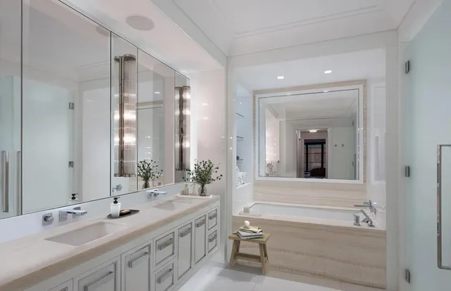 a spacious bedroom with a bed and a large window