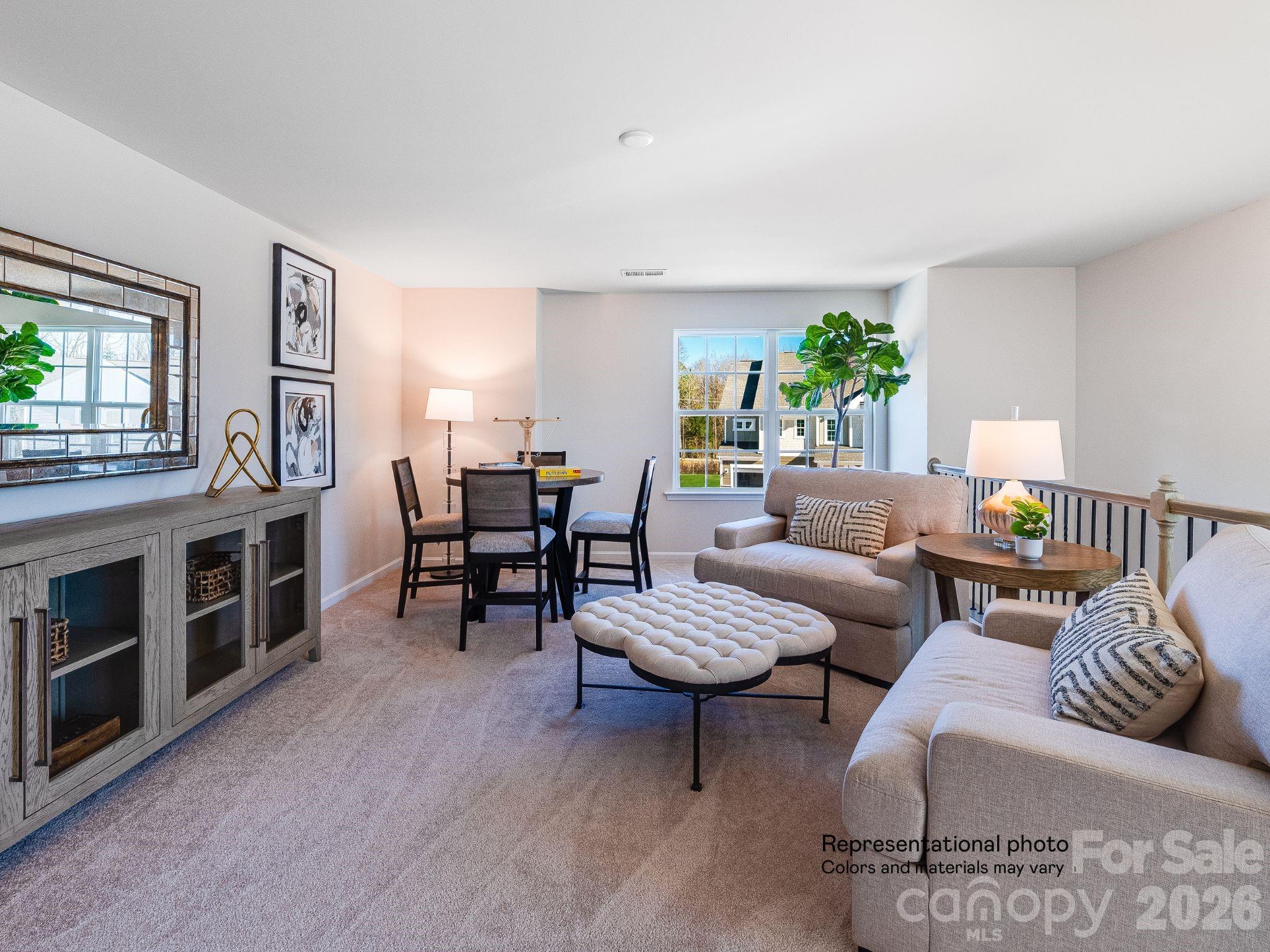 1015 Widgeon Way, Unit 203 Belmont, NC 28012 - Photo 13 of 17 a living room with furniture and wooden floor