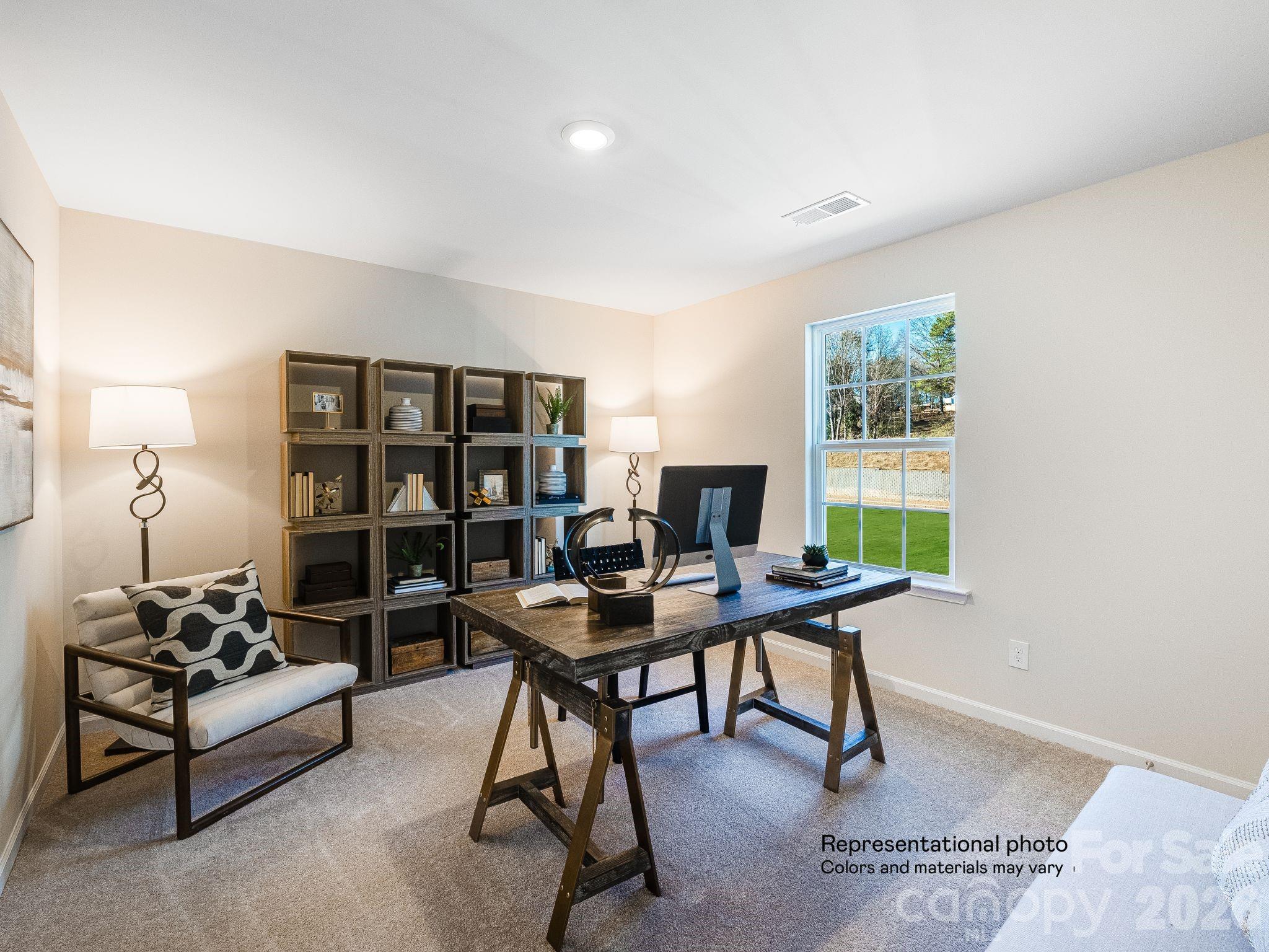 1015 Widgeon Way, Unit 203 Belmont, NC 28012 - Photo 15 of 17 a view of a workspace with furniture and a window