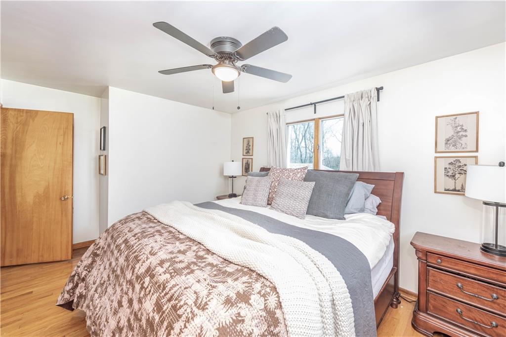 15 Watson Street Sewickley, PA 15143 - Photo 16 of 43 a bed room with a bed and a ceiling fan