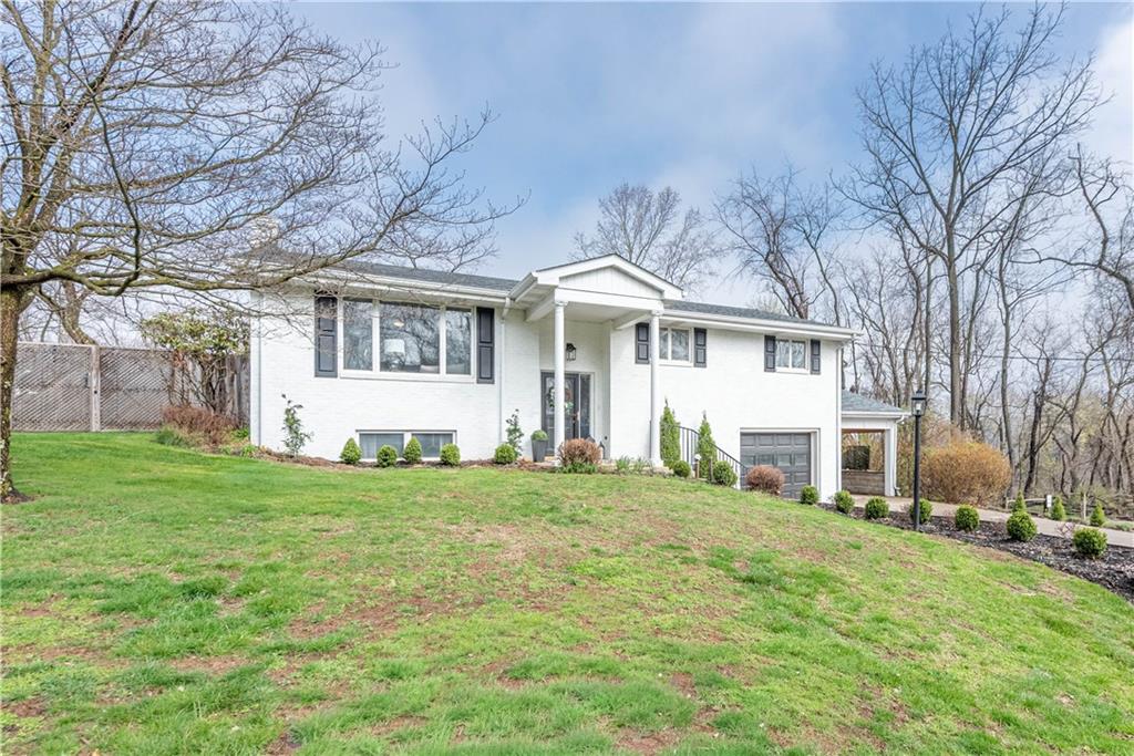 15 Watson Street Sewickley, PA 15143 - Photo 2 of 43 a front view of a house with a garden