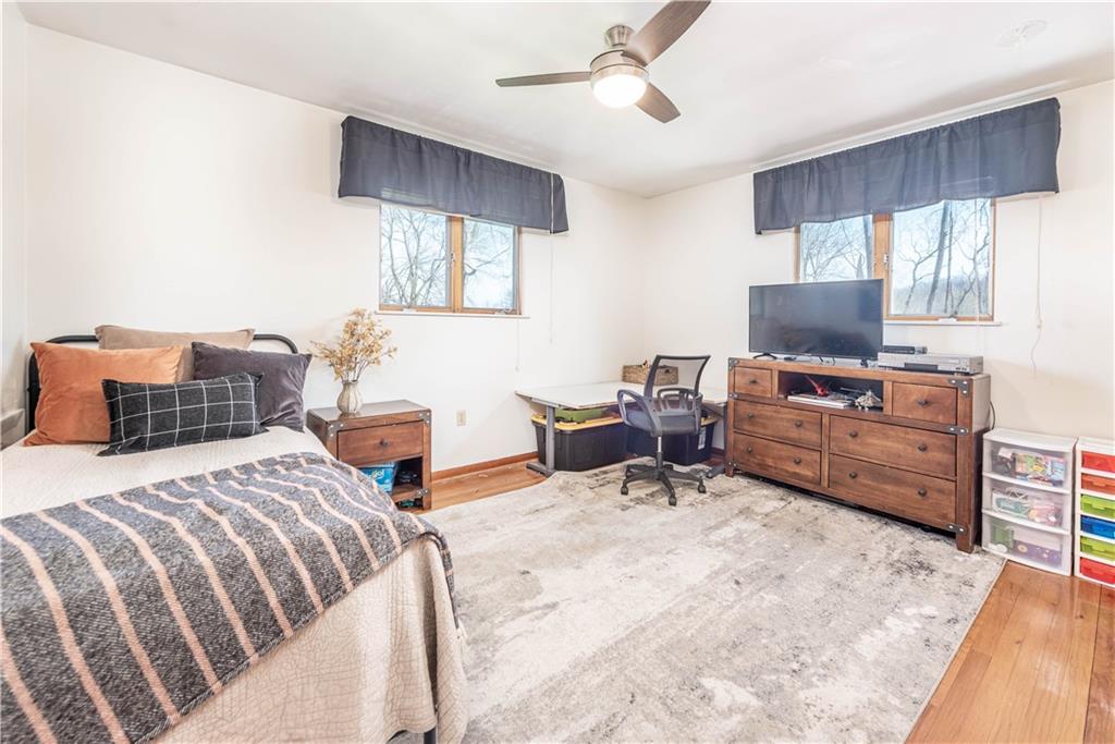 15 Watson Street Sewickley, PA 15143 - Photo 21 of 43 a bedroom with a bed a computer on the desk and a couch