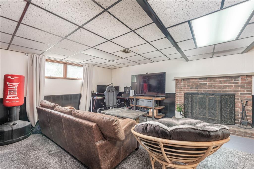 15 Watson Street Sewickley, PA 15143 - Photo 28 of 43 a living room with furniture and a flat screen tv