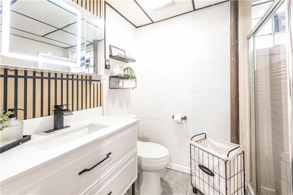 15 Watson Street Sewickley, PA 15143 - Photo 29 of 43 a bathroom with a sink a toilet and a shower