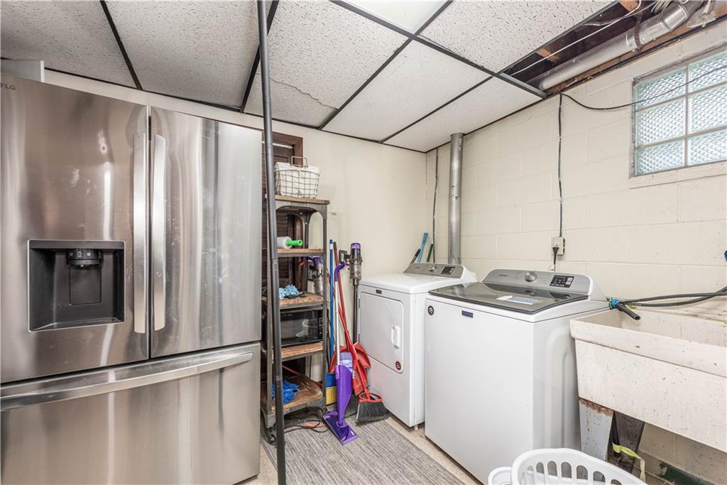 15 Watson Street Sewickley, PA 15143 - Photo 32 of 43 a kitchen with stainless steel appliances granite countertop a refrigerator and a stove top oven