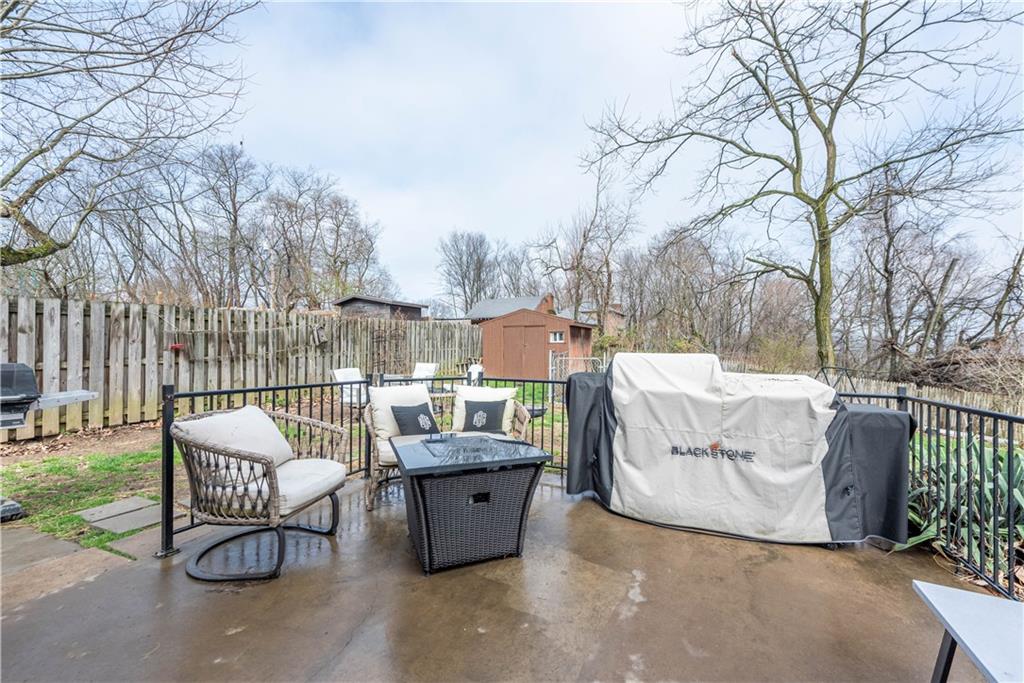 15 Watson Street Sewickley, PA 15143 - Photo 33 of 43 a view of a chairs and table in the back yard of the house
