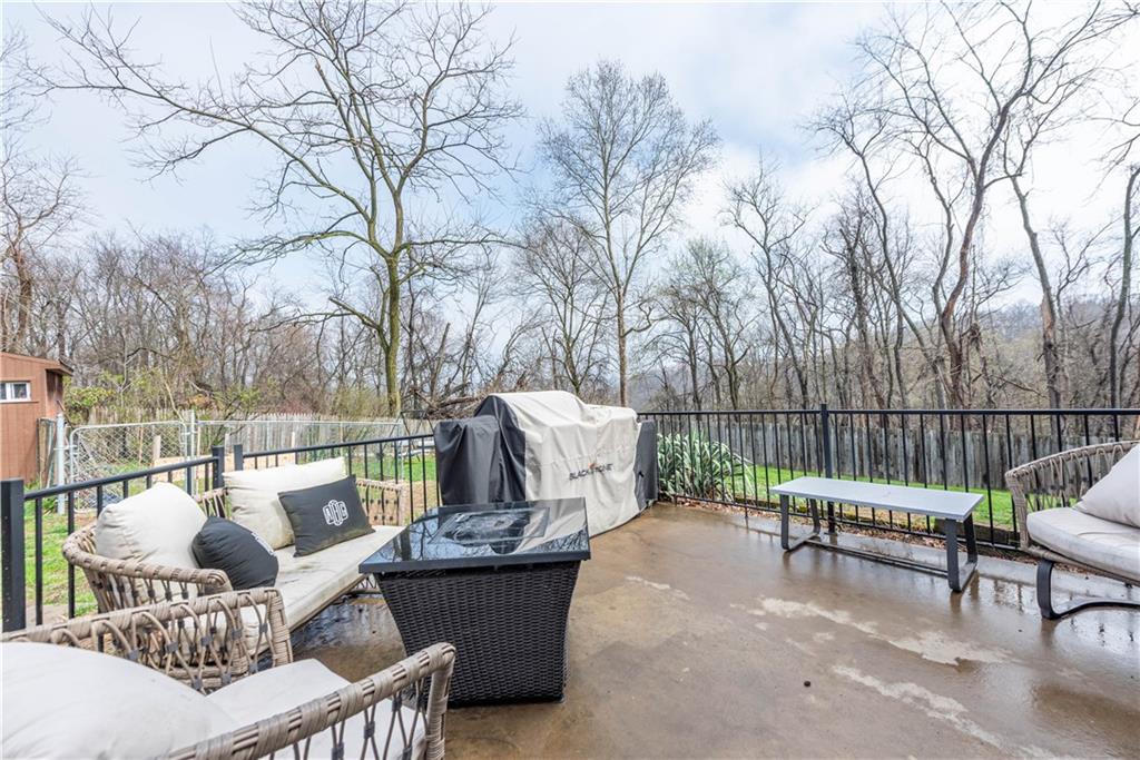 15 Watson Street Sewickley, PA 15143 - Photo 34 of 43 a view of a patio with furniture and a fire pit