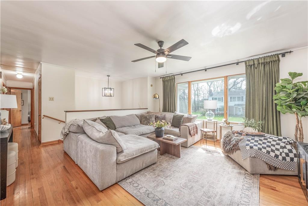 15 Watson Street Sewickley, PA 15143 - Photo 5 of 43 a living room with furniture and a large window with wooden floor