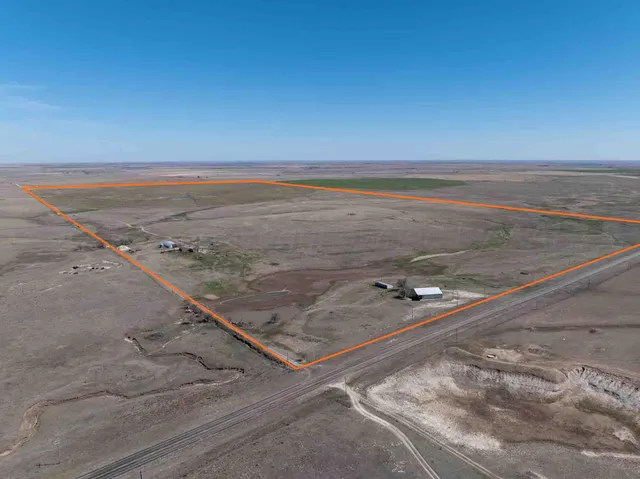 an aerial view of a house with ocean view