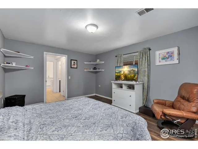 a bedroom with a bed and furniture