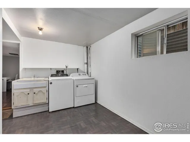 a kitchen with a stove cabinets and wooden floor