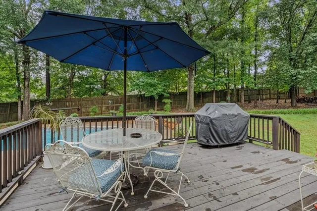 a view of a chairs and table under an umbrella