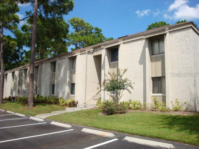 129 Springwood Circle, Unit B Longwood, FL 32750 - Photo 1 of 1 a front view of a house with garden