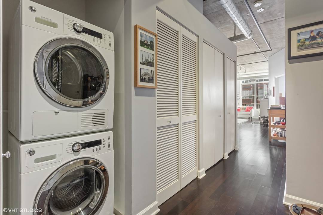 111 South Morgan Street, Unit 711 Chicago, IL 60607 - Photo 10 of 11 a view of a hallway with washer and dryer