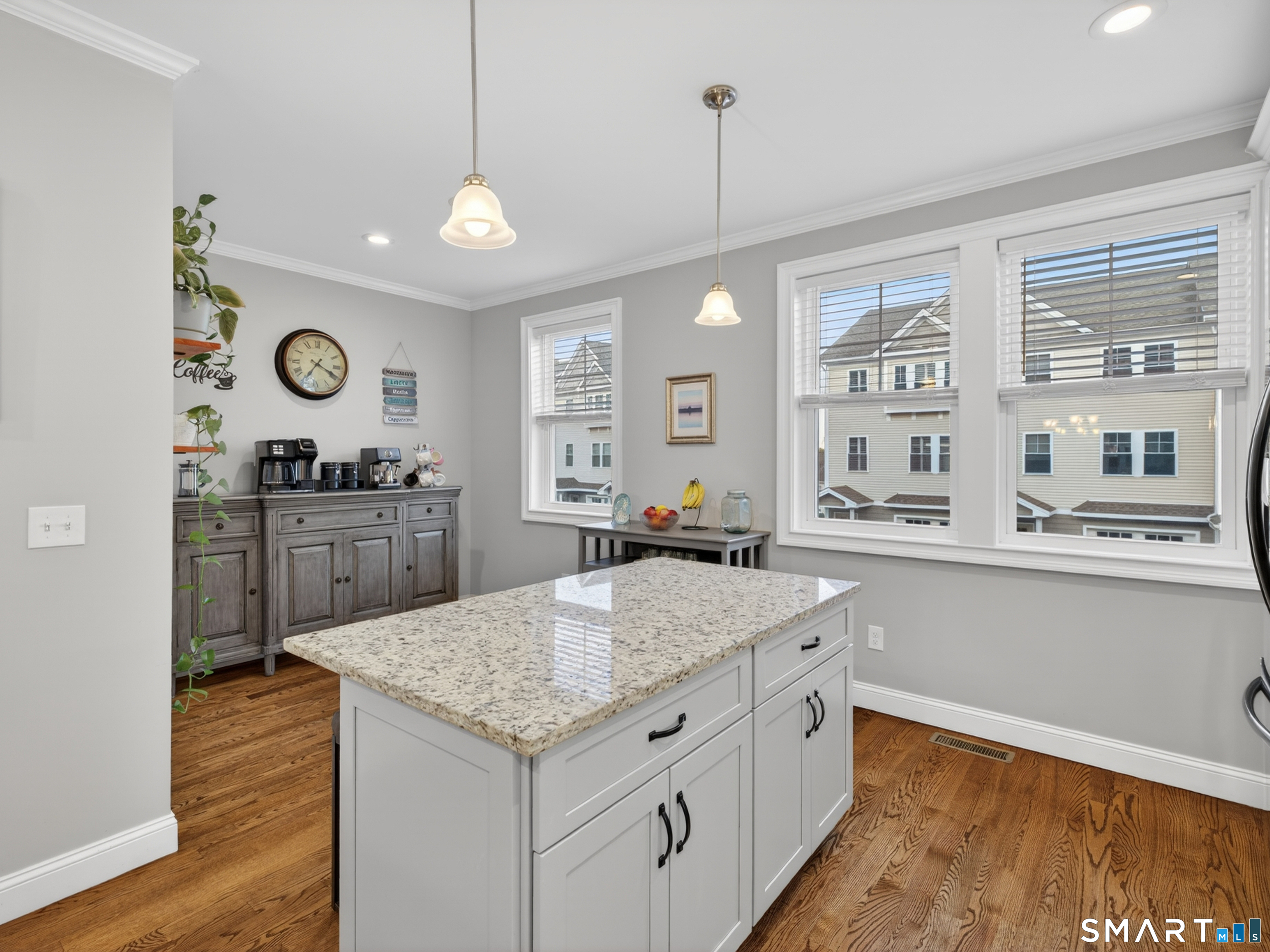 34 Village Crossing, Unit 34 Niantic, CT 06357 - Photo 17 of 38 a kitchen with a stove a sink a window and cabinets