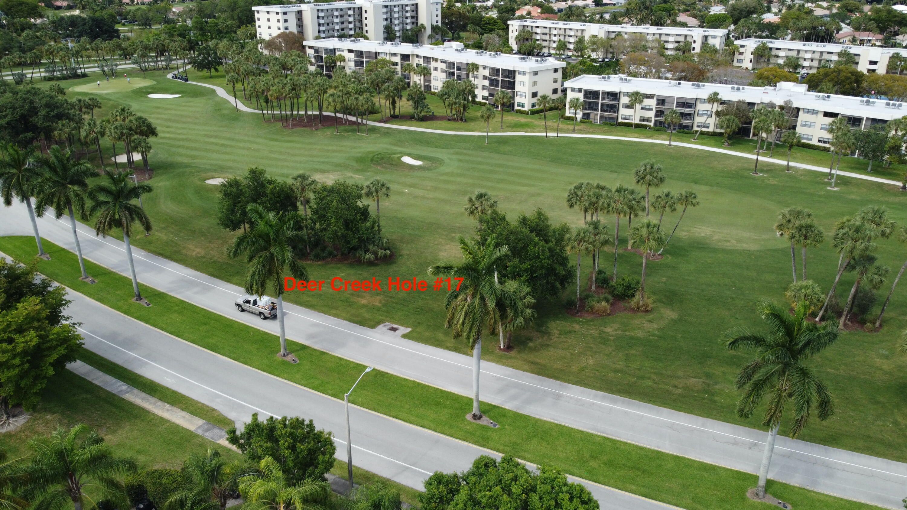 297 Deer Creek Boulevard, Unit 1305 Deerfield Beach, FL 33442 - Photo 26 of 51 a view of a lake with a houses