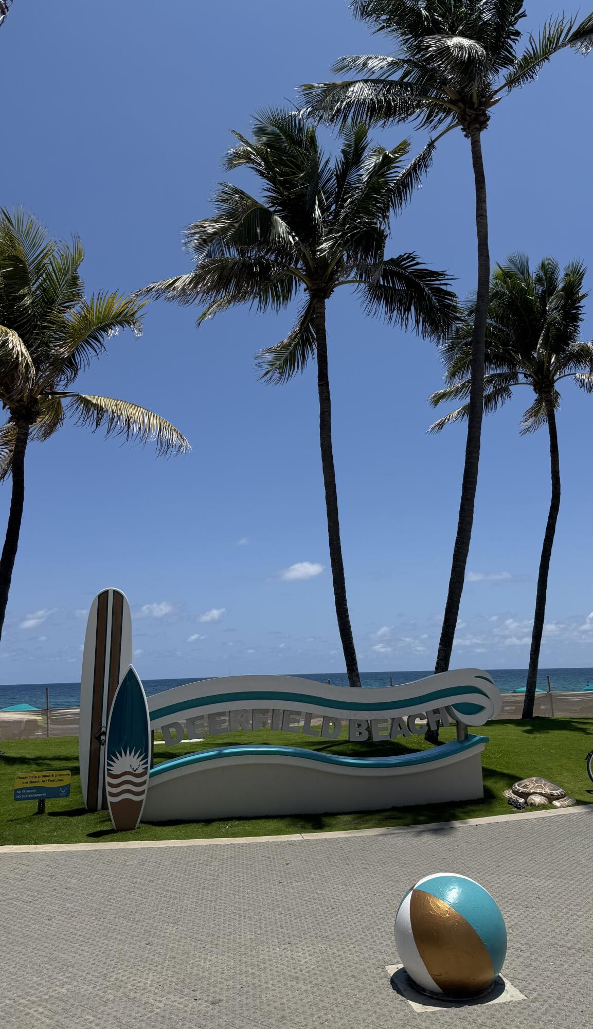 297 Deer Creek Boulevard, Unit 1305 Deerfield Beach, FL 33442 - Photo 36 of 51 a front view of a house with a garden