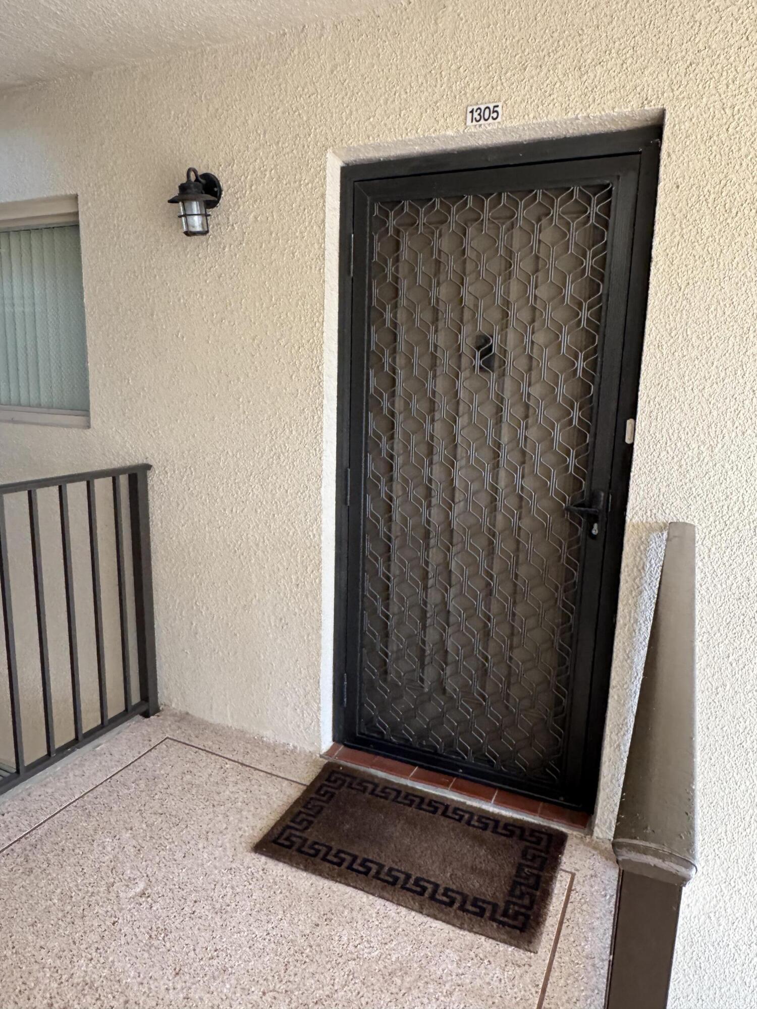 297 Deer Creek Boulevard, Unit 1305 Deerfield Beach, FL 33442 - Photo 4 of 51 a view of a door