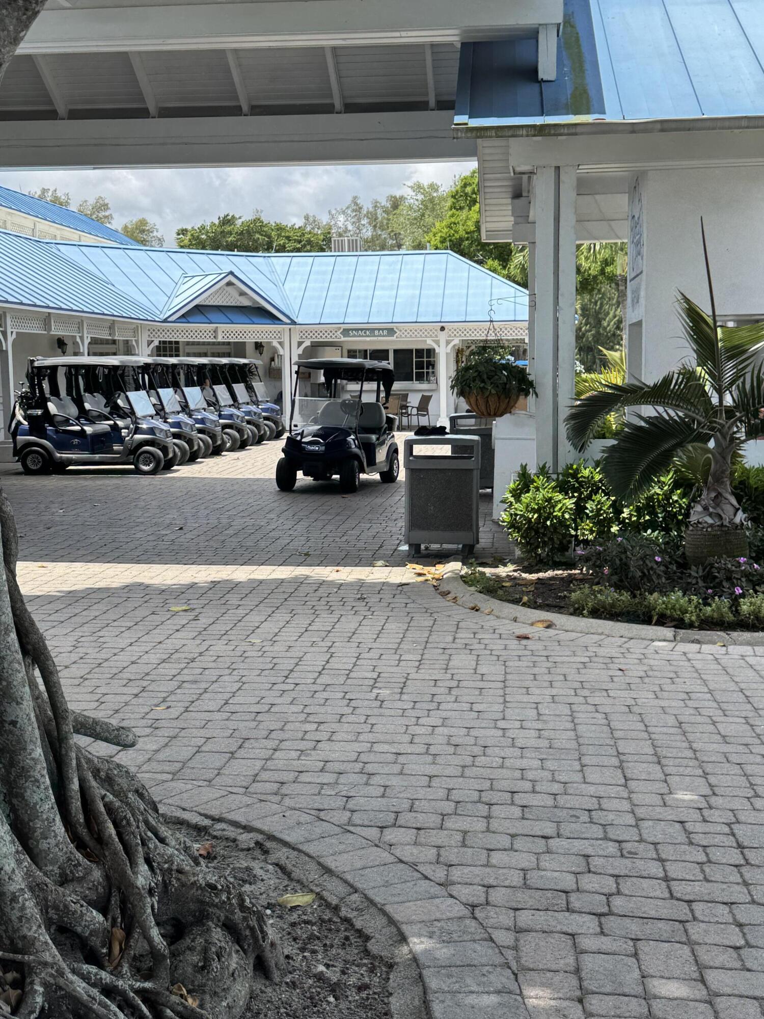 297 Deer Creek Boulevard, Unit 1305 Deerfield Beach, FL 33442 - Photo 42 of 51 a view of outdoor space with seating area