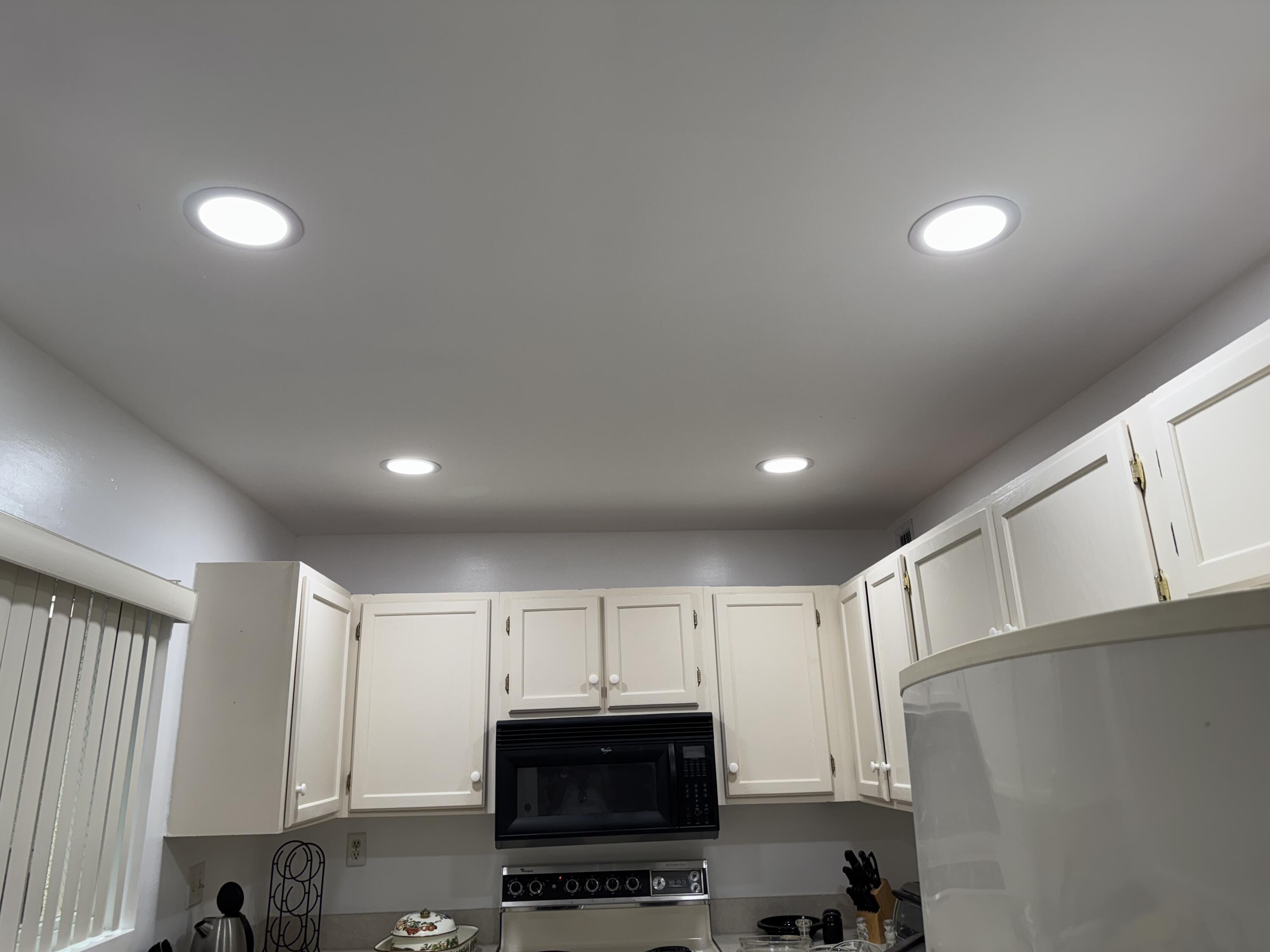 297 Deer Creek Boulevard, Unit 1305 Deerfield Beach, FL 33442 - Photo 5 of 51 a view of kitchen with microwave and cabinets