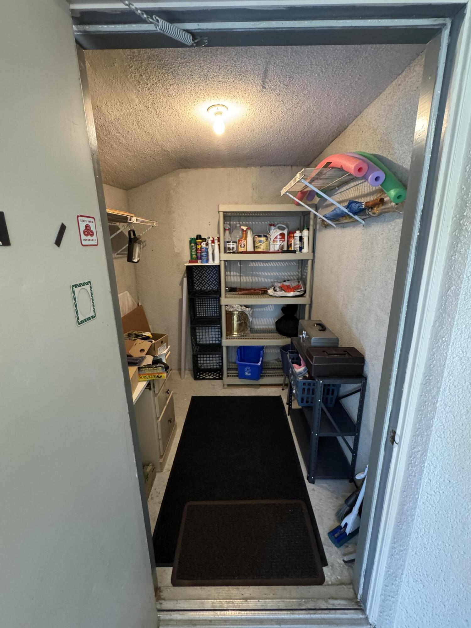 297 Deer Creek Boulevard, Unit 1305 Deerfield Beach, FL 33442 - Photo 10 of 51 a living room with furniture and a rug