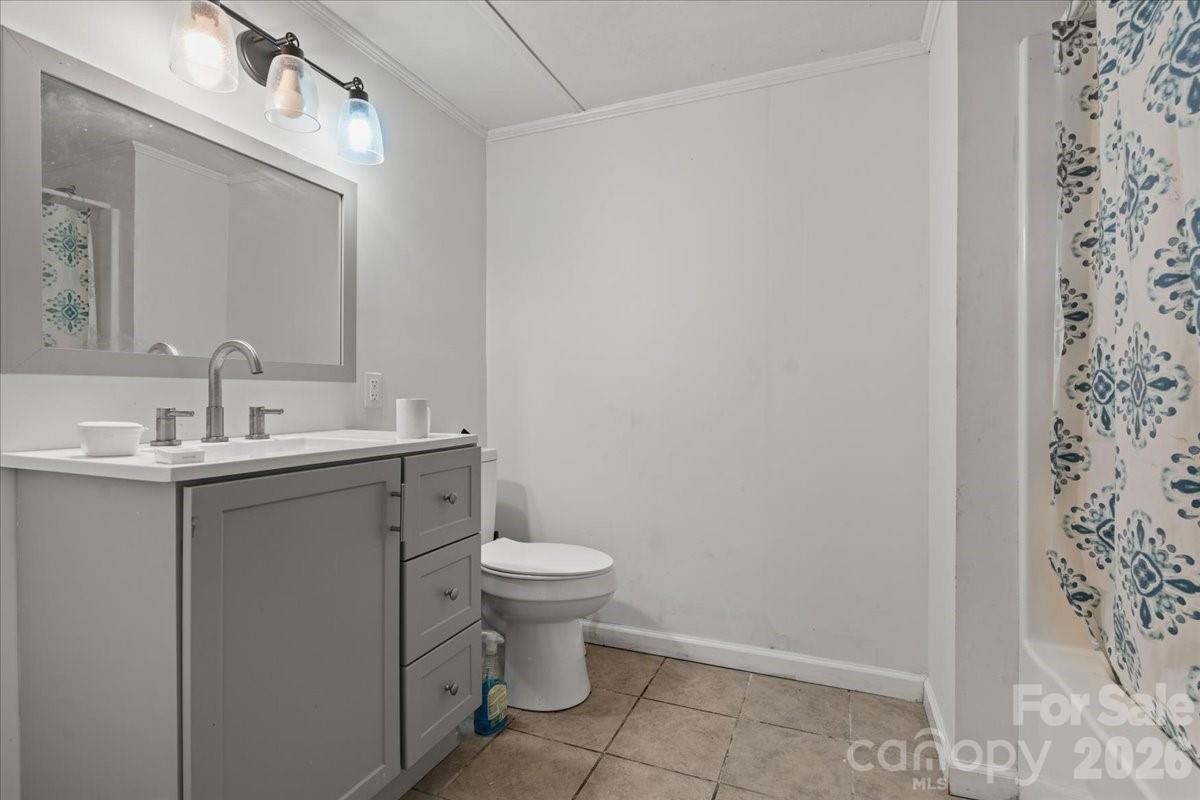501 Church Street Cheraw, SC 29520 - Photo 12 of 48 a bathroom with a sink toilet and vanity