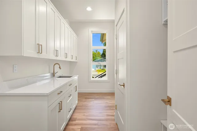 a hallway with a sink and a window