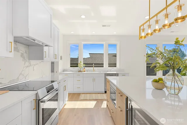 a kitchen with a sink stove and cabinets