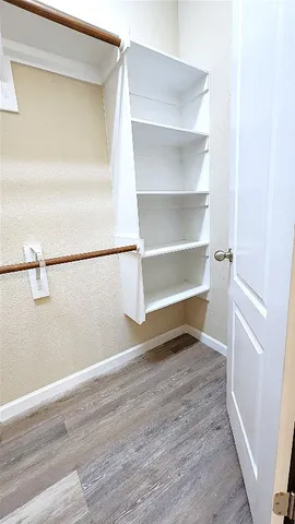 a view of an empty room and a window