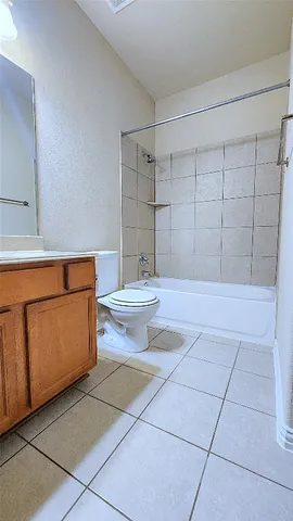 a view of an empty room with a fan