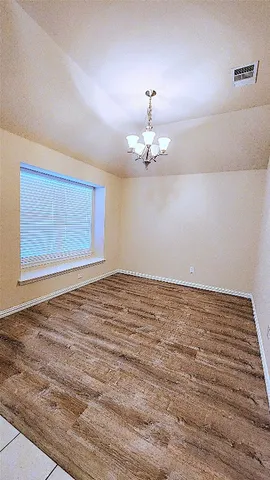 a kitchen with stainless steel appliances a stove top oven a sink a counter top space and cabinets