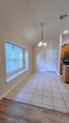 a kitchen with granite countertop a sink and a stove