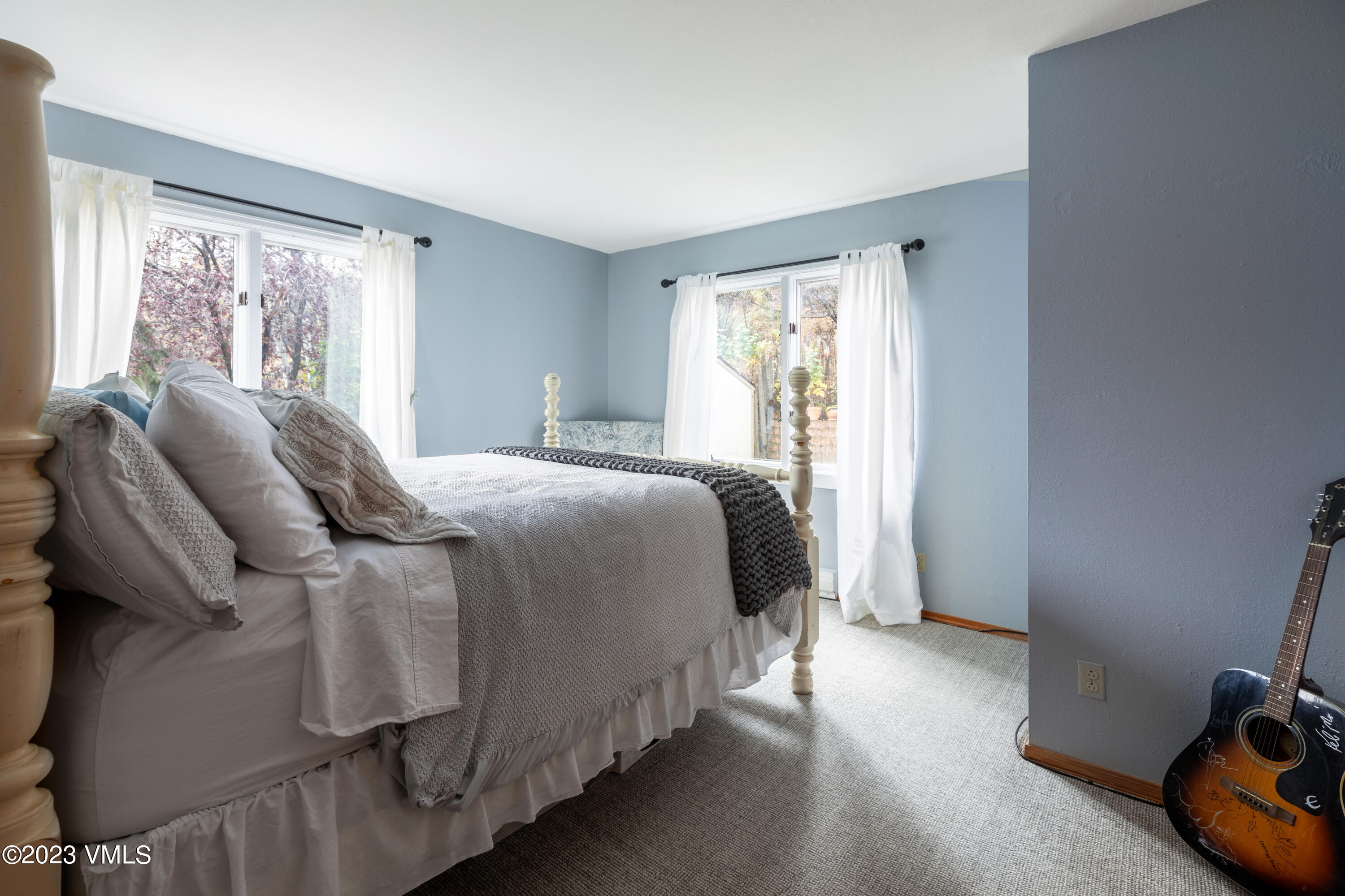 1176 Deer Boulevard, Unit A Avon, CO 81620 - Photo 5 of 8 a bedroom with a bed and a window