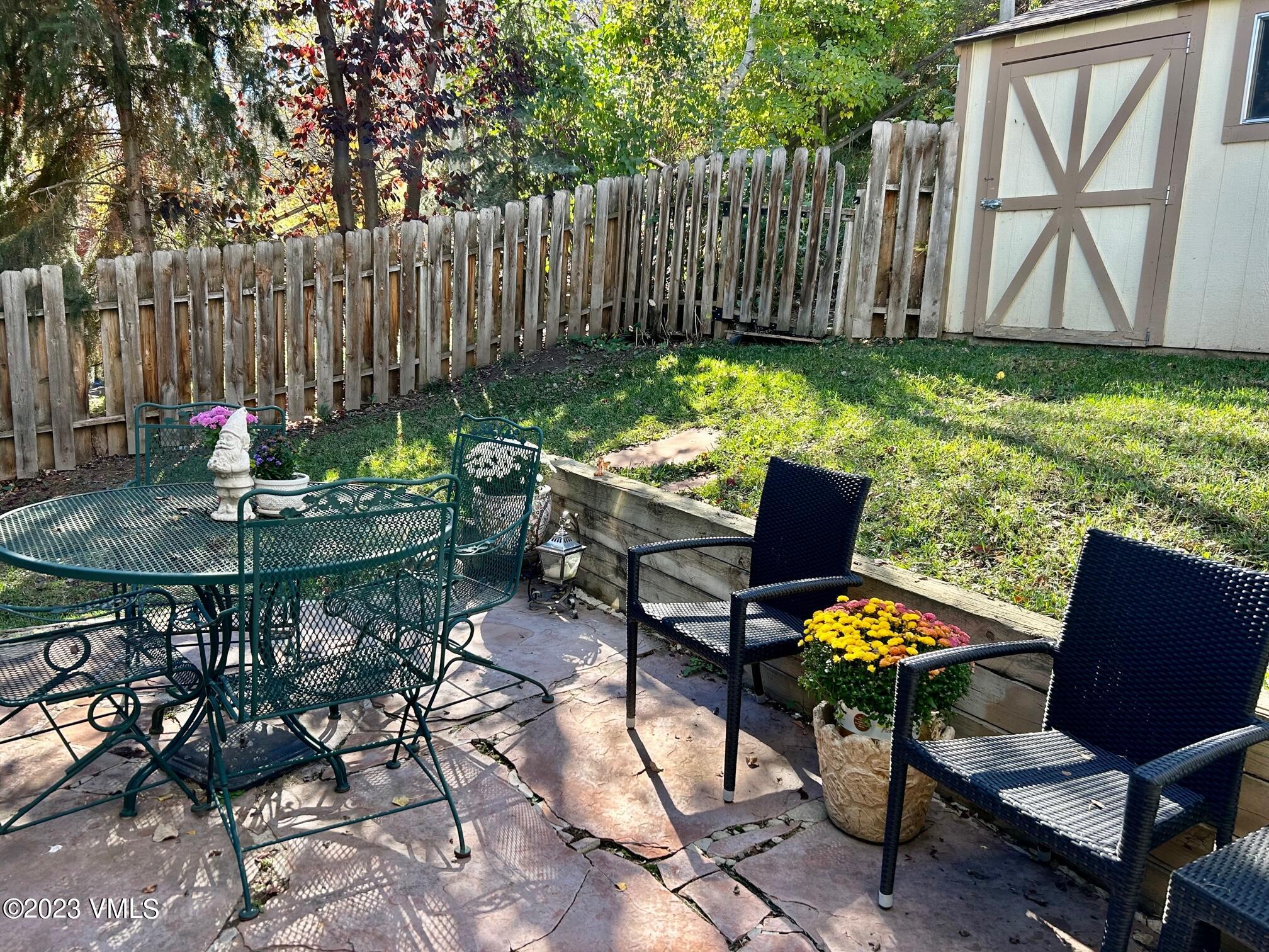 1176 Deer Boulevard, Unit A Avon, CO 81620 - Photo 8 of 8 a backyard view with a seating space