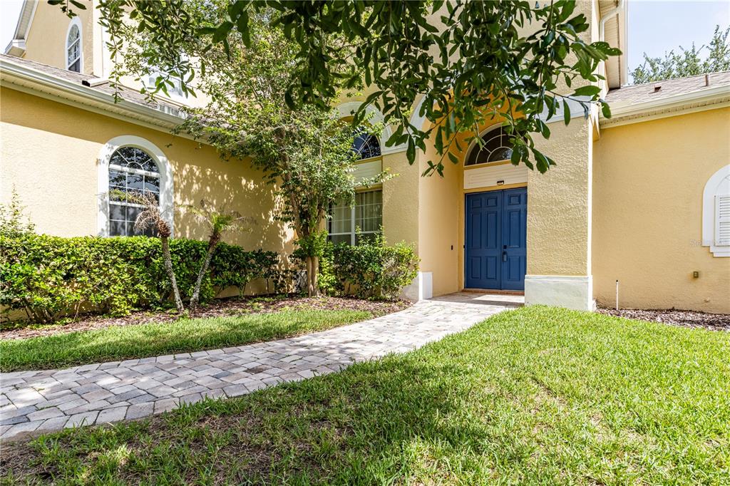 2718 Knightsbridge Road Clermont, FL 34711 - Photo 4 of 72 a front view of a house with garden